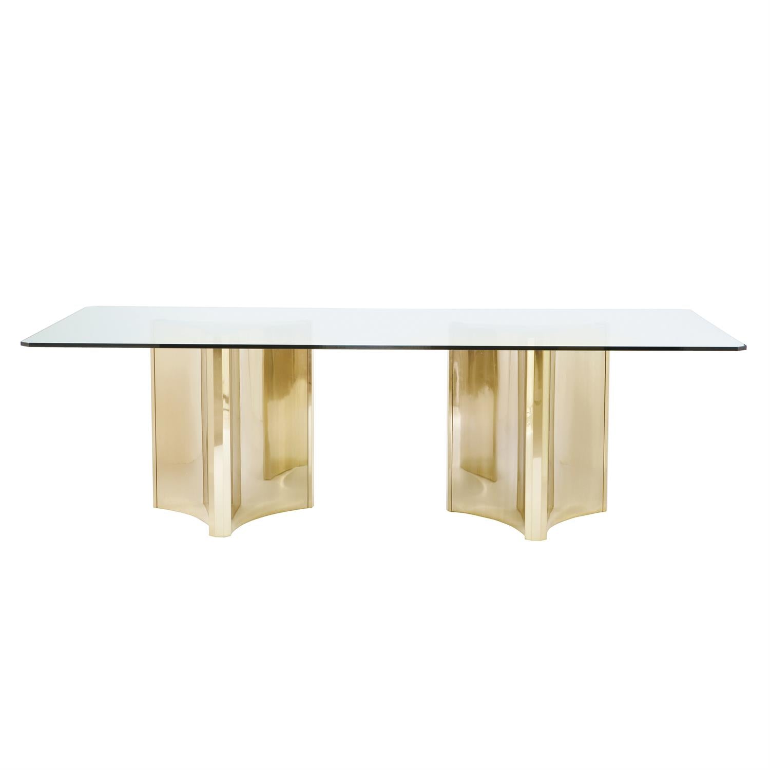 dining-table-sculptural-steel-pedestals-gleaming-patinated-brass-finish-adjustable-glides-pop-in-glass-bumpers-glass-top